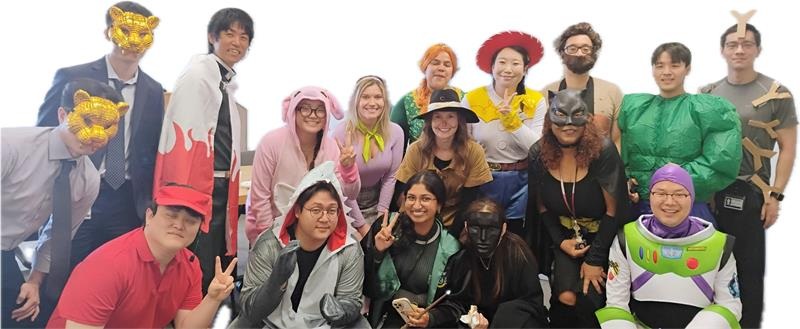 Choi Lab members posing together in Halloween costumes.